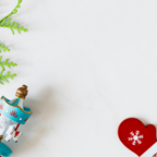 Colorful Christmas decorations on a white background with ample copy space.